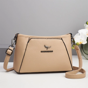 Chic beige lychee textured underarm shoulder bag with metal kangaroo logo and strap