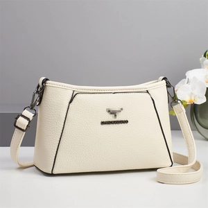 Chic beige underarm bag with lychee texture and metallic logo for versatile daily wear
