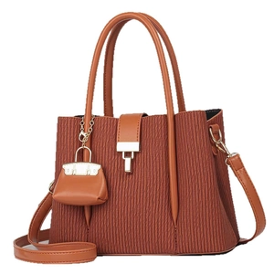 Caramel brown striped tote bag with layered pleats and adjustable shoulder strap