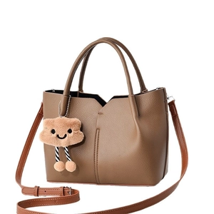 Brown litchi texture tote bag with plush cloud charm and adjustable shoulder strap