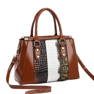 Fashionable patchwork crocodile texture handbag with glossy brown finish and gold hardware