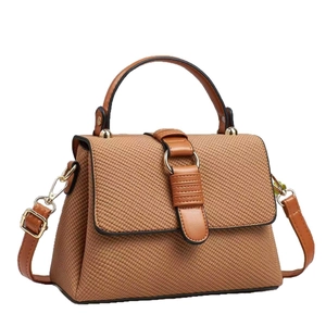 Brown woven texture handbag with top handle and adjustable shoulder strap in retro style
