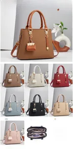Detailed view of woven leather tote bag size 30x12.5x23cm and multi-layer interior