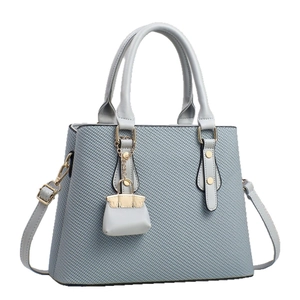 Fashionable grey blue tote bag with top handles, crossbody strap and mini pouch charm