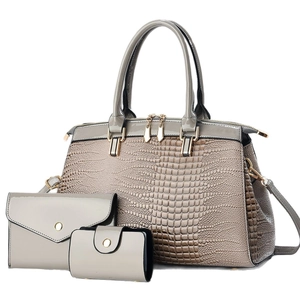 Three-piece women's handbag set with grey crocodile pattern and shiny leather finish