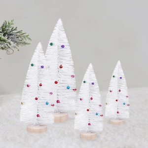 Four white frosted mini Christmas trees with colorful ornaments and wooden bases