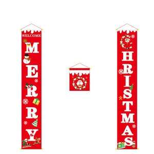 Detail of red Christmas door banners with Merry Christmas text and cartoon Santa prints