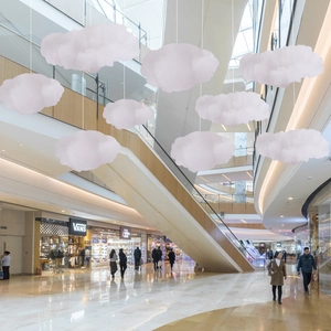 Hanging fluffy artificial clouds in pink and white gradient for mall ceiling decoration