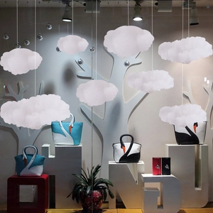 Cloud-shaped decorative pendants made of white fluffy cotton for window display setups