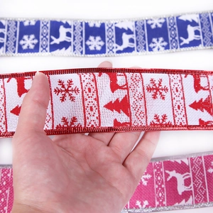 Christmas ribbons with snowflake and reindeer patterns in burlap and satin textures
