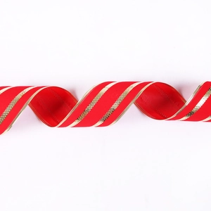 Red velvet Christmas ribbon with gold wired edges and stripes on white background