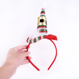 Close-up of a glittering striped Christmas elf hat headband with white feather trim