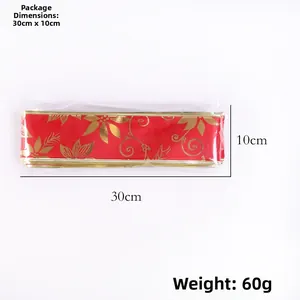 Detailed view of red Christmas ribbon with gold floral patterns and size specifications