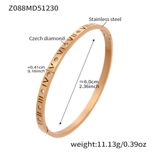Detail of 18k gold plated stainless steel bangle with Roman numerals and Czech diamonds