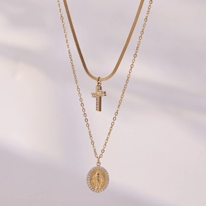 Bohemian gold layered necklace featuring a zircon cross and Virgin Mary medal pendant