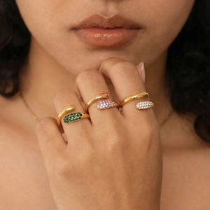 Minimalist teardrop rings in gold with green, pink, and white colorful zircon stones