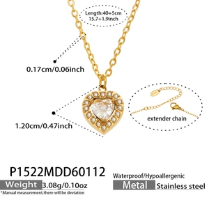 Detailed view of gold heart pendant with zircon inlay showing dimensions and weight