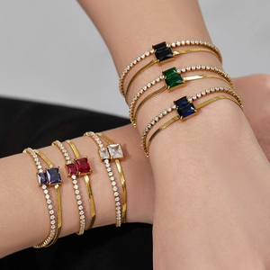 Double-layered gold stainless steel bracelet with 2mm colored cubic zirconia and emerald-cut gems