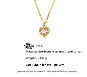 Macro detail of heart pendant necklace in gold stainless steel with sparkling zircons