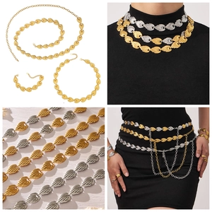 Macro view of bicolor leaf texture metal necklace and waist chain jewelry set