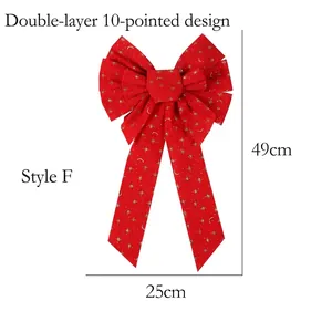 Detail of Style F handmade red velvet Christmas bow with gold star and moon patterns
