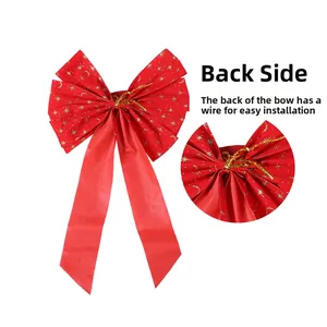 Detail of red velvet Christmas bow with gold stars and back wire tie for tree decoration