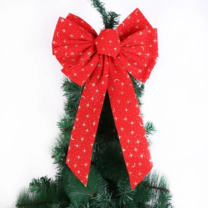 Red velvet Christmas bow with gold star and moon patterns for tree and wreath decor