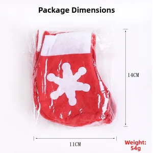 Detail view of 14cm red Christmas sock with white snowflake print in packaging