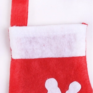 Detailed close-up of red and white non-woven Christmas stocking hanging ornament