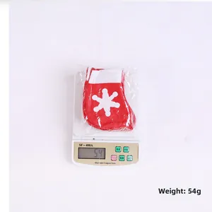 Detail of red Christmas stocking with white snowflake weighing 54g for holiday decor