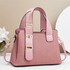 Pink pleated macaron handbag with adjustable strap and elegant gold hardware details