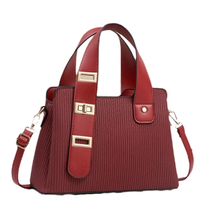 Burgundy pleated handbag with vertical stripes and adjustable shoulder strap for women