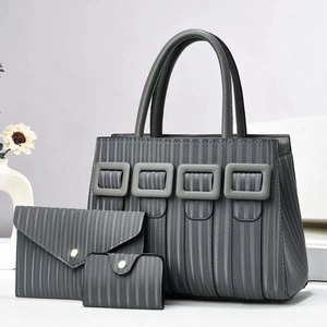 Detailed view of grey 3-piece bag set with vertical texture and stylish square buckles