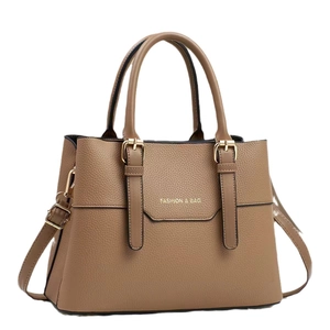 Brown litchi grain leather tote bag with gold buckles and dual top handles