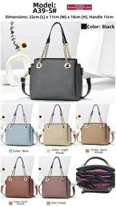 Detail view of stylish tote bag with chain strap and internal multi-compartment structure
