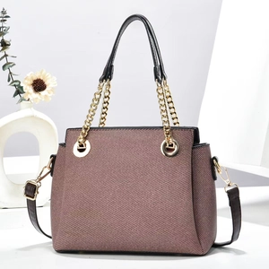 Elegant trapezoid chain tote bag in brown textured fabric with black leather trim