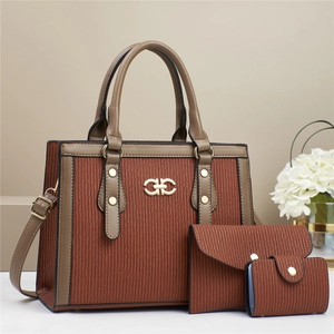 Three-piece brown striped handbag set featuring tote, wallet and card holder