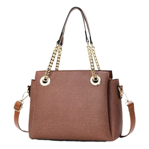 Brown textured leather tote bag with gold chain handles and adjustable shoulder strap