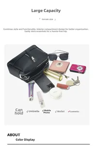 Detail view of black litchi leather bag showing large capacity with organized essentials