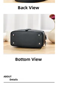 Detail view of the black textured leather bag bottom featuring four protective silver studs