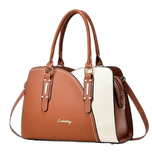 Fashionable brown and cream contrast leather tote bag with gold logo and shoulder strap