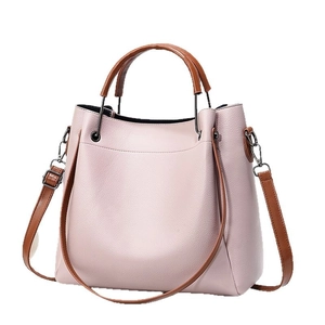 Sac seau minimaliste en cuir souple rose violet avec poignées brunes et texture grainée