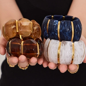 Chunky geometric resin stretch bracelets with gold metal bars in assorted colors