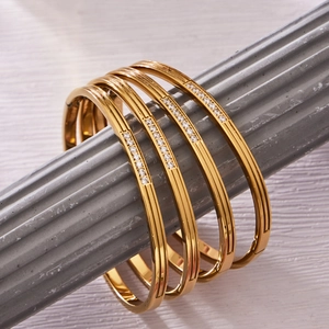 Set of four 18k gold plated stainless steel bangles with micro-pave zircon crystals