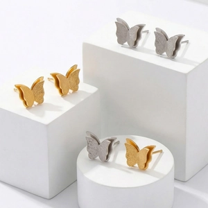 Frosted gold and silver butterfly stud earrings in minimalist stainless steel design