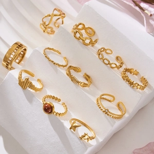 Golden stainless steel geometric stackable ring set with star and heart hollow patterns