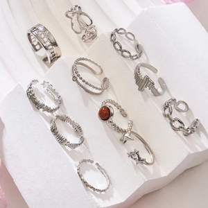 Set of 10 silver minimalist geometric stainless steel rings with heart and star patterns