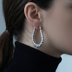 U-shaped wavy stainless steel hoop earrings with glossy silver finish for women
