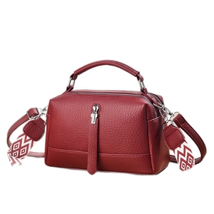 Burgundy faux leather crossbody bag with ethnic style wide strap and top handle
