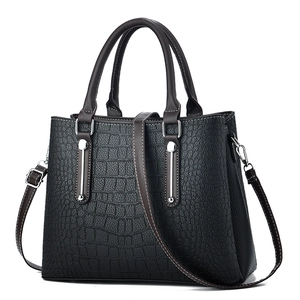 Black crocodile pattern tote bag for women with dual handles and adjustable shoulder strap